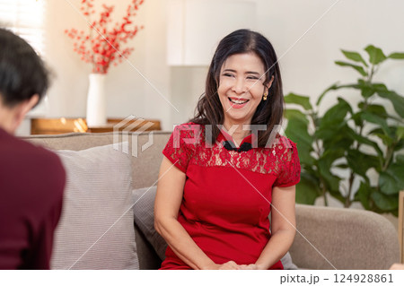 Elderly celebrating chinese new year traditions home setting candid moments joyful atmosphere intimate viewpoint Elderly celebrating chinese new year traditions home setting candid moments joyful atmosphere intimate viewpoint 124928861