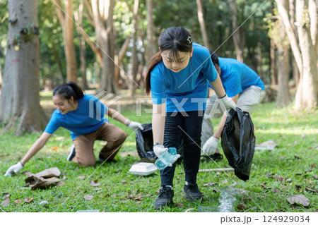 Family Leading Park Cleanup with Volunteers for a Greener Future Family Leading Park Cleanup with Volunteers for a Greener Future 124929034