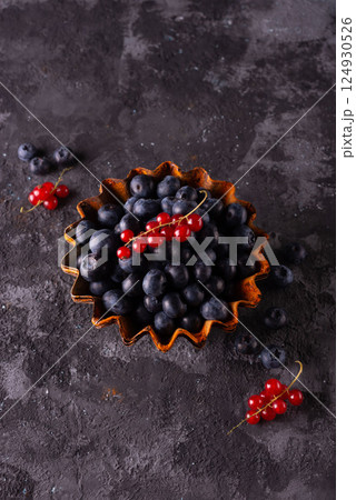 minimalistic still life of berries on an abstract background in a rustic style 124930526