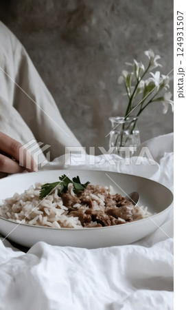 Libyan kabsa with rice, meat, and vegetables served in authentic style on a decorative plate with traditional herbs 124931507