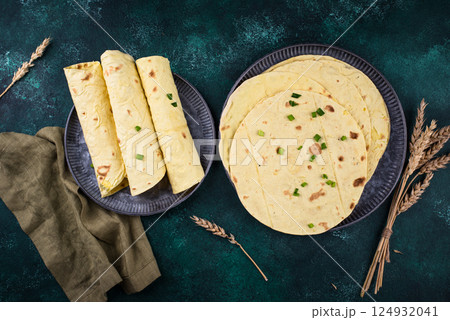 Lavash flat bread on green background Lavash flat bread on green background 124932041