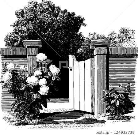 Vintage garden gate with blooming flowers and lush foliage in black and white 124932739