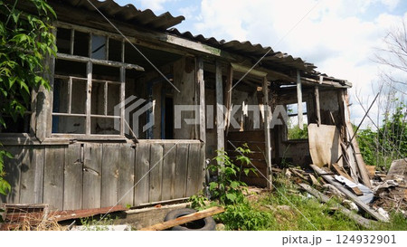 View to destroyed residential buildings at Kharkivska oblast. Ruined houses after bomb attacks on ukrainian territory from russia army. Consequences of russian invasion of Ukraine. Slow motion View to destroyed residential buildings at Kharkivska oblast. Ruined houses after bomb attacks on ukrainian territory from russia army. Consequences of russian invasion of Ukraine. Slow motion 124932901