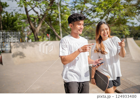 Friends enjoy a delightful day at the skate park, embracing community spirit Friends enjoy a delightful day at the skate park, embracing community spirit 124933480
