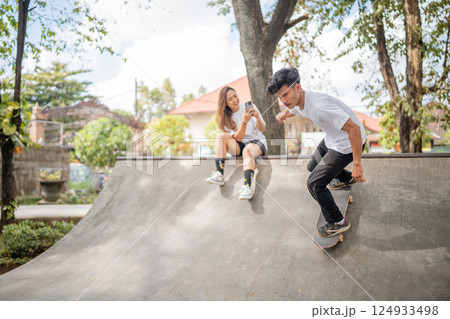 Skateboarding in the Park Enjoy Tricks, Joyful Moments, and Memories with Friends Skateboarding in the Park Enjoy Tricks, Joyful Moments, and Memories with Friends 124933498