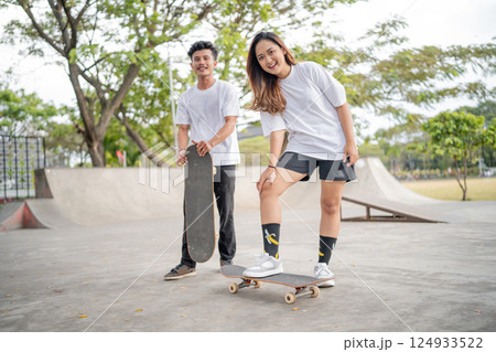 A group of friends skateboarding and having fun together at the park today A group of friends skateboarding and having fun together at the park today 124933522