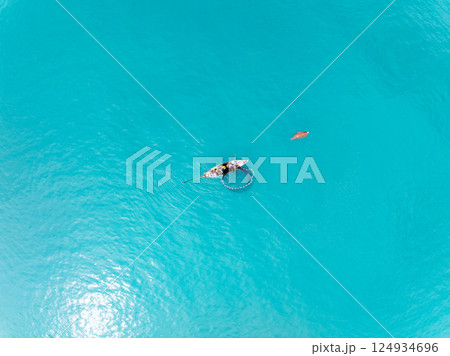 Sea surface aerial view,Bird eye view photo of waves water surface texture,Summer sea background,Beautiful nature Amazing view sea background 124934696