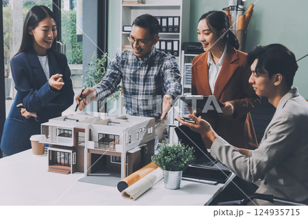 Construction, planning and architects meeting about design of building, strategy and working in industrial collaboration. Architecture workers talking about maintenance project with paper and a model 124935715