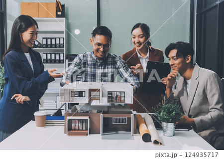 Construction, planning and architects meeting about design of building, strategy and working in industrial collaboration. Architecture workers talking about maintenance project with paper and a model 124935717