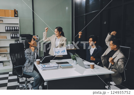 Business team showing unity with their hands together, Close up top view of young business people putting their hands together. people together to work as team to ensure the success of the business 124935752