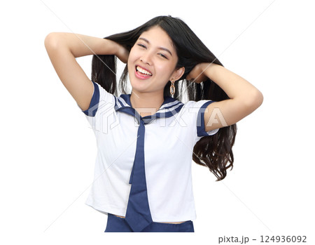 young woman in japanese student cosplay uniform on white background 124936092