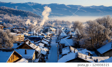 serene mountain village blanketed in snow, with smoke rising from chimneys serene mountain village blanketed in snow, with smoke rising from chimneys 124936315
