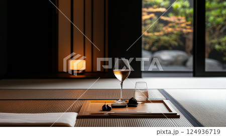 serene Japanese style setting featuring sake and glass of plum wine 124936719