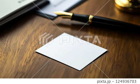 blank business card on polished wooden desk with fountain pen nearby blank business card on polished wooden desk with fountain pen nearby 124936783