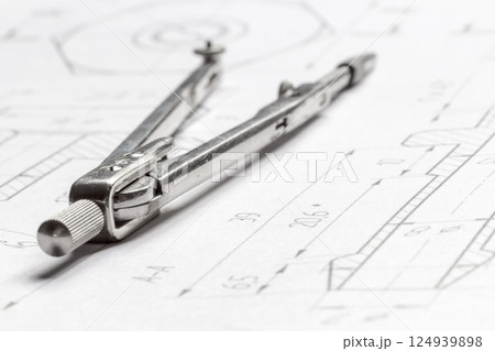 Lying drawing compasses 124939898