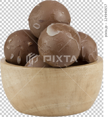chocolate balls in wooden cup. chocolate balls in wooden cup. 124940657