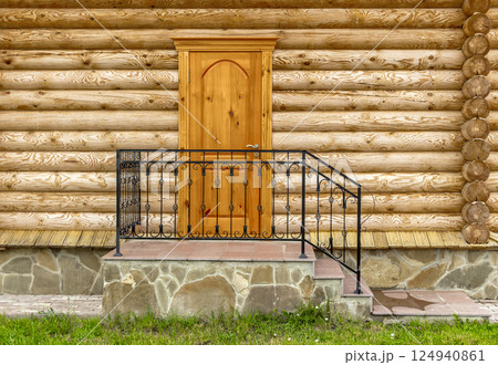 A porch of a wooden house 124940861