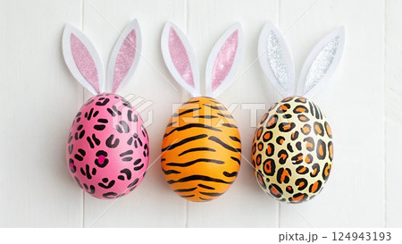 painted easter eggs on blue wooden background 124943193