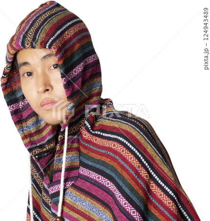 Man wear overcoat with hood on head. 124943489