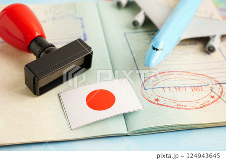 Japan passport with approved stamp on document for tourism to immigration at airport in country. 124943645