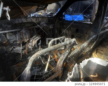burnt house and car, viewed inside 124945071