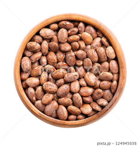 Pinto beans in a wooden bowl. Dried variety of common beans, Phaseolus vulgaris. A type of bean that are tan with reddish-brown specks. Most popular bean in Northern Mexico and Southwestern USA. Photo Pinto beans in a wooden bowl. Dried variety of common beans, Phaseolus vulgaris. A type of bean that are tan with reddish-brown specks. Most popular bean in Northern Mexico and Southwestern USA. Photo 124945838