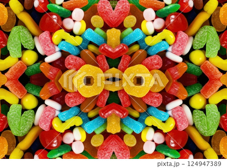 Colorful gummy candies create a delightful kaleidoscope pattern in vibrant hues Colorful gummy candies create a delightful kaleidoscope pattern in vibrant hues 124947389