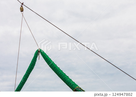 Yachting, many ropes and fishing nets on sailing boat. 124947802