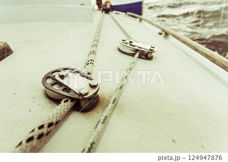 Detailed closeup of rigging on sail boat Detailed closeup of rigging on sail boat 124947876