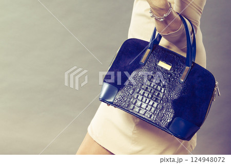 Part body of elegant woman with bag. Part body of elegant woman with bag. 124948072