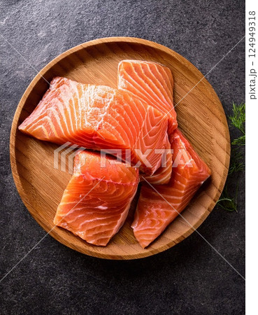 raw salmon one pieces on the wooden plate raw salmon one pieces on the wooden plate 124949318