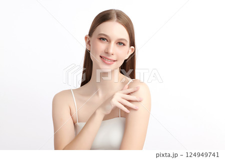 A beautiful young Asian woman with clean, fresh skin against a white background. Skincare, facial treatment, cosmetology, beauty, and spa. An elegant portrait of an Asian woman. A beautiful young Asian woman with clean, fresh skin against a white background. Skincare, facial treatment, cosmetology, beauty, and spa. An elegant portrait of an Asian woman. 124949741