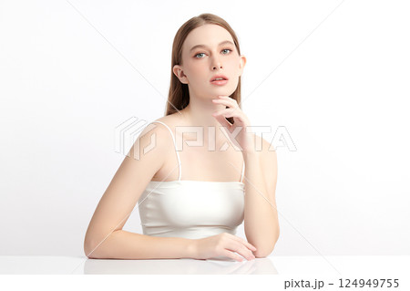 A beautiful young woman with clean, fresh skin against a white background. Skincare, facial treatment, cosmetology, beauty, and spa. An elegant portrait of an woman. A beautiful young woman with clean, fresh skin against a white background. Skincare, facial treatment, cosmetology, beauty, and spa. An elegant portrait of an woman. 124949755