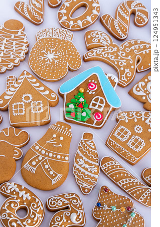 Gingerbread decorated with white sugar glaze. Food background. Christmas cookies. Gingerbread decorated with white sugar glaze. Food background. Christmas cookies. 124951343