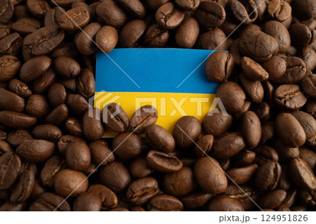 Ukraine flag on coffee beans, shopping online for export or import food product. 124951826