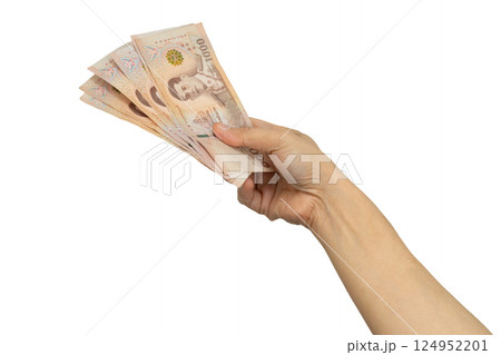 Asian woman holding Thai baht banknote money in hand isolated on white background. 124952201