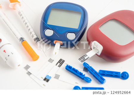 Glucometer lancet and test stick measuring human blood sugar level for diabetes. 124952664
