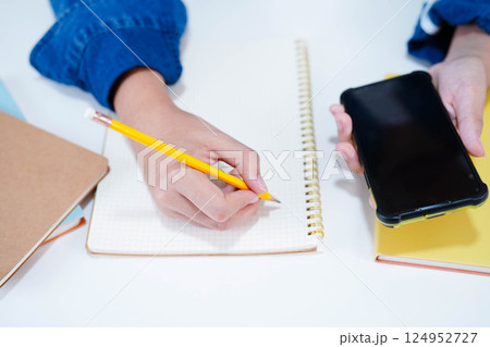 Teenage using smart phone for communication, search data internet website to learn. 124952727