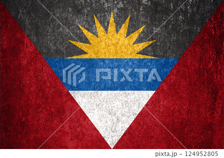 Antigua and Barbuda state flag on a metal surface. Dirty grunge Antigua and Barbuda flag. 124952805