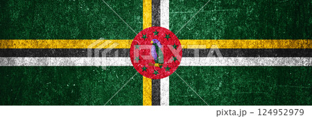 Dominica state flag on a metal surface. Banner of dirty grunge Dominica flag. Dominica state flag on a metal surface. Banner of dirty grunge Dominica flag. 124952979