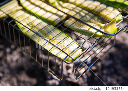 Grilled green zucchini. Outdoor recreation, vacation, summer, warmth, sun. Healthy eating. Grilled green zucchini. Outdoor recreation, vacation, summer, warmth, sun. Healthy eating. 124953784