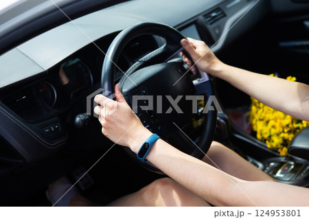 Young girl driving a car, handing over the right to drive a car. Young girl driving a car, handing over the right to drive a car. 124953801