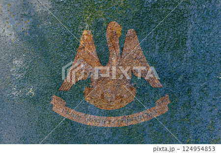 Louisiana State Flag. Dirty Louisiana state flag on rusty metal surface. Louisiana State Flag. Dirty Louisiana state flag on rusty metal surface. 124954853