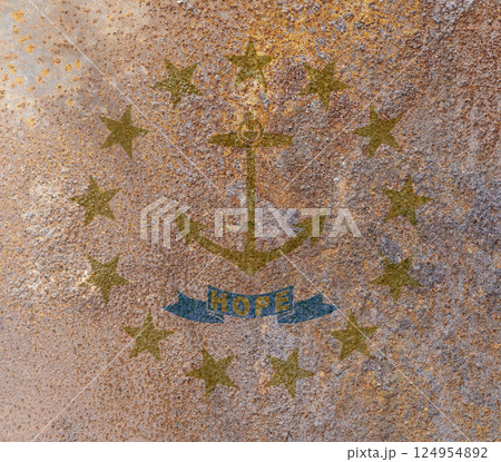 Rhode Island State Flag. Dirty Rhode Island state flag on rusty metal surface. 124954892