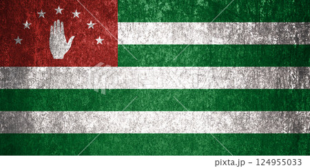 Republic of Abkhazia State Flag. Dirty Abkhazia flag on metal surface. 124955033