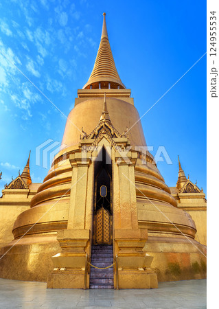 Golden stupa at Wat Phra Kaew, also known as the Temple of the Emerald Buddha a famous temple in Thailand Golden stupa at Wat Phra Kaew, also known as the Temple of the Emerald Buddha a famous temple in Thailand 124955534
