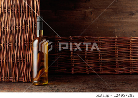 Bottle of white wine on a vintage background. 124957285