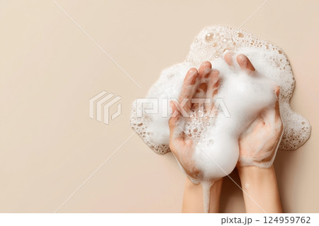 Hands holding soapy bubbles, emphasizing cleanliness and hygiene. 124959762