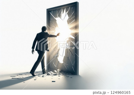 A man makes his way through a glass door. Space for text. A man makes his way through a glass door. Space for text. 124960165