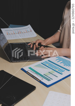 Tax deduction planning concept. Women use a calculator to calculate expenses and taxes to receive tax deductions for personal individual Income. tax return for individual persons.monthly expenses 124960793